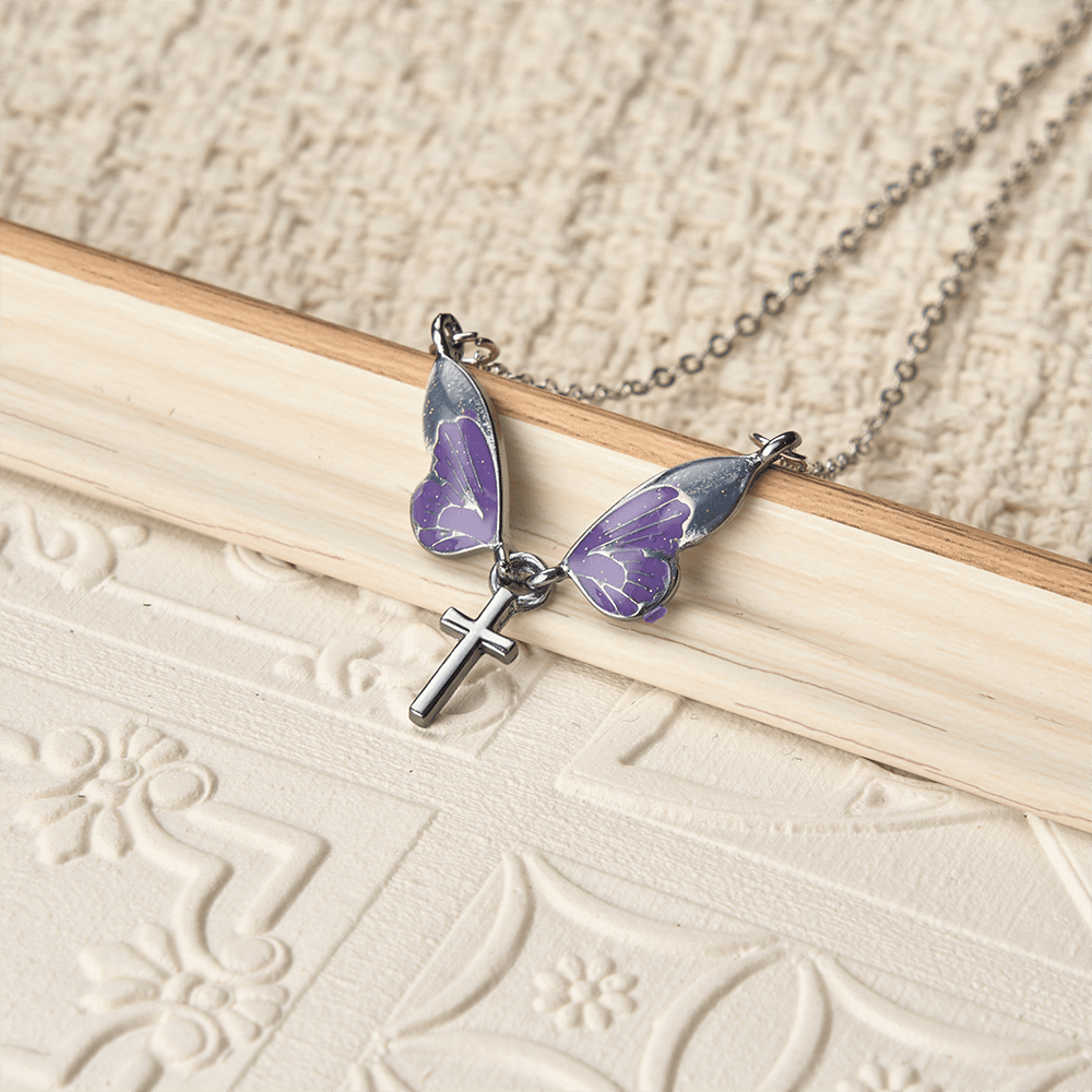 Christianartworkshop Whimsical Butterfly Wing Cross Pendant Necklace: A Dazzling Symbol of Divine Light and Hope - image 1