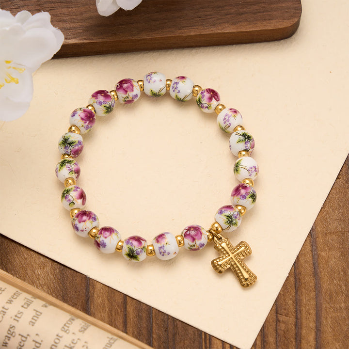 Christianartworkshop 4-Style Floral Ceramic Bead Stretch Bracelet with Gold-Tone Cross Charm: A Symbol of Gentle Heavenly Grace - Purple - image 0