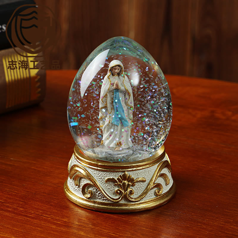 Christianartworkshop Egg Shaped Glitter Snow Globe With Praying Madonna Statue: Emblem of Pure Heavenly Supplication - Our Lady - image 0